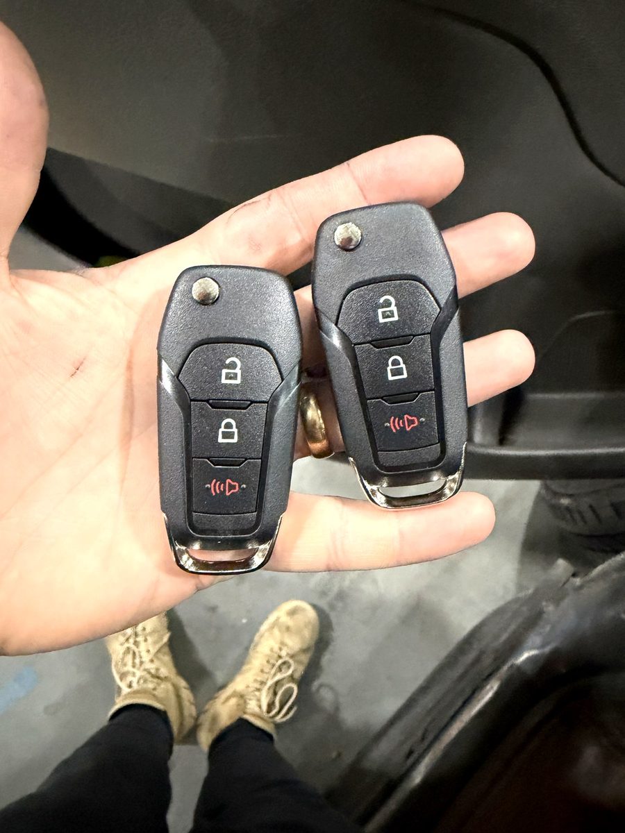 Two remote head keys, cut and programmed on site