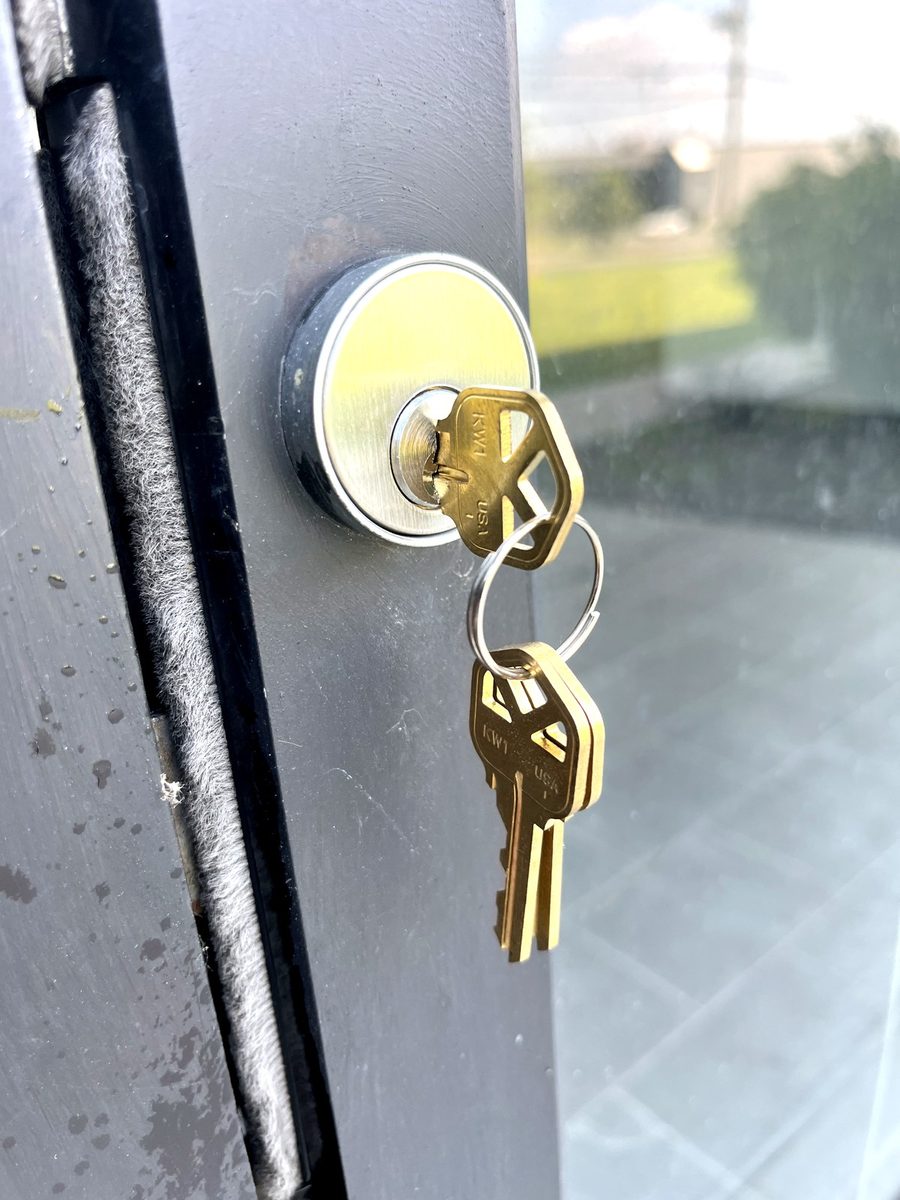 A mortise cylinder replaced in an aluminium storefront door