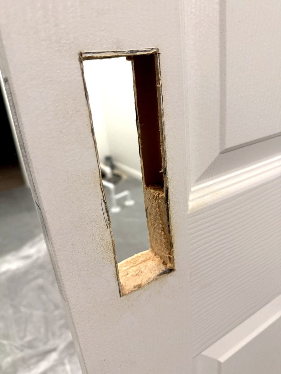 The pocket cut into the door face, ready for the lock body to drop in